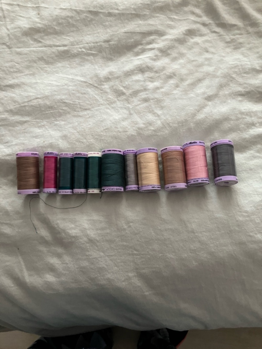 Assorted Sewing Thread Spools in Neutral, Pink, Green and Gray